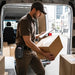 Newland mobile computer waist belt holster used by delivery worker during package handling and route workflow