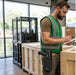 Logistics employee with a Point Mobile Computer terminal on his belt in a loading dock