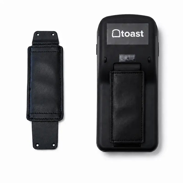 Back view of a Toast Go 2 payment device shown beside a black leather replacement hand strap with stitched padding and mounting holes.
