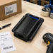 Agoz brand leather belt case with a Datalogic handheld scanner on a shipping table