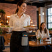 Restaurant server wearing Dejavoo POS holster with waist belt