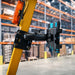 AGOZ iPad Tablet Mount Holder for Forklifts installed on a yellow forklift frame in a warehouse setting.
