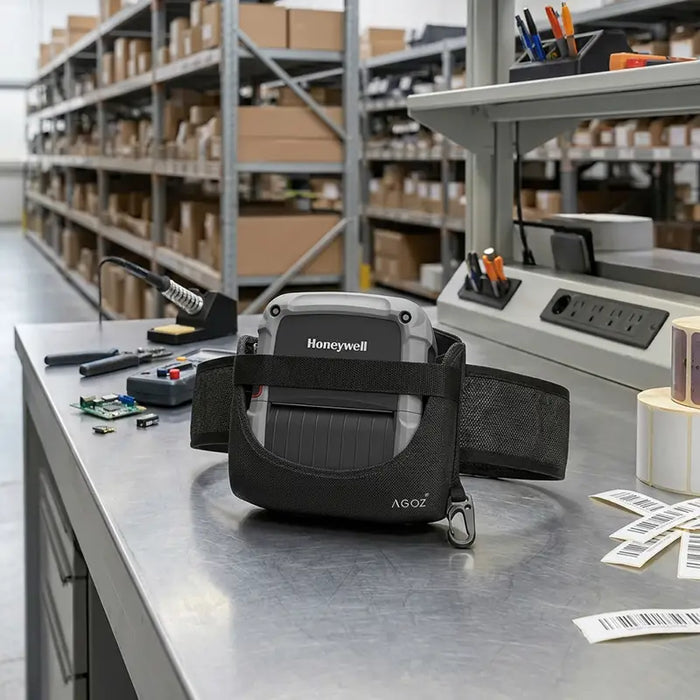 Honeywell RP4f mobile printer in waist belt carrying case on workbench in warehouse packing and labeling station.