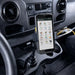 Newland mobile computer secured in a cup holder vehicle cradle mount inside a commercial vehicle console.